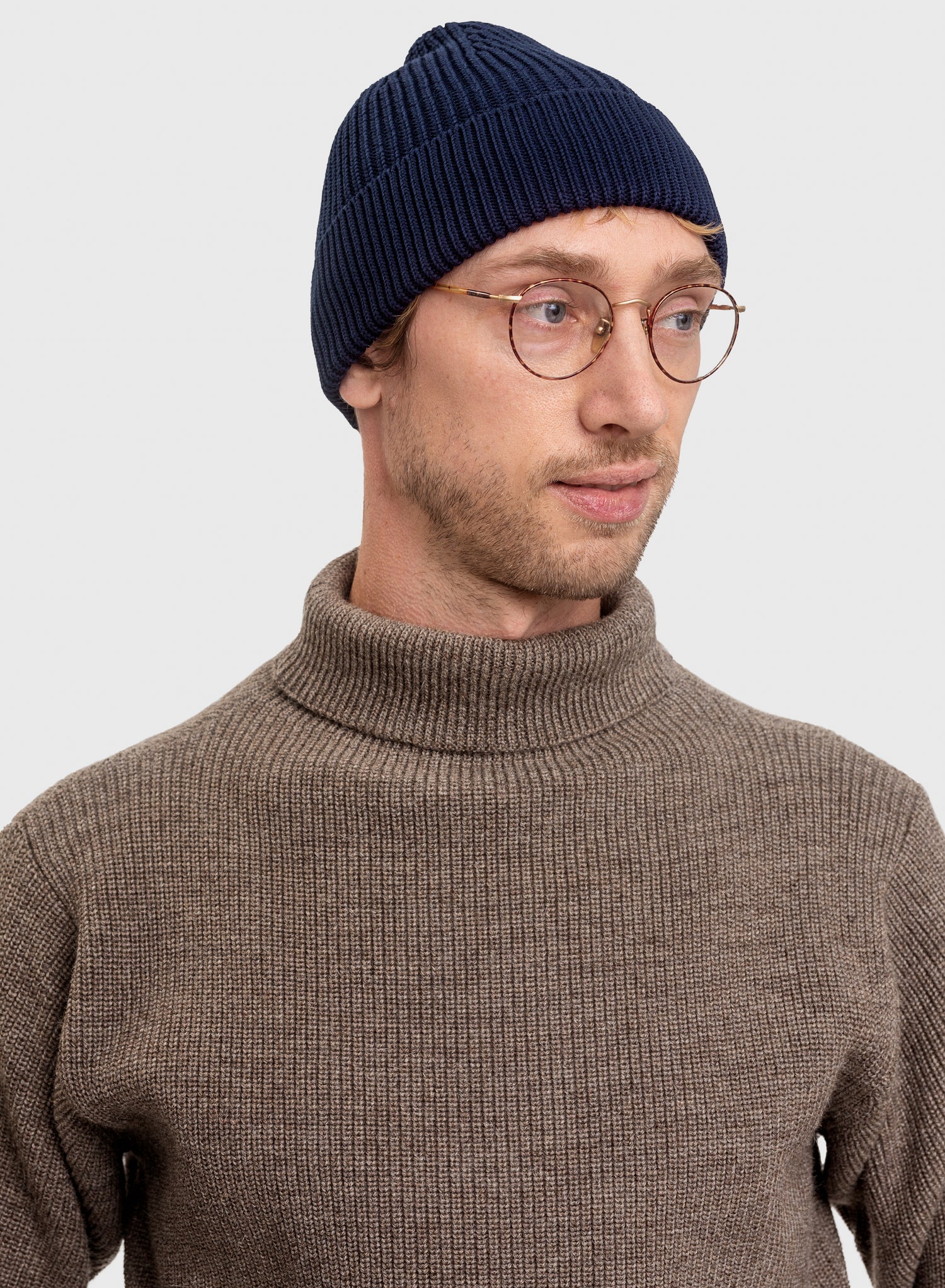 Jens Peter wearing Sailor Turtleneck in Natural Taupe and Medium Beanie in Royal Blue